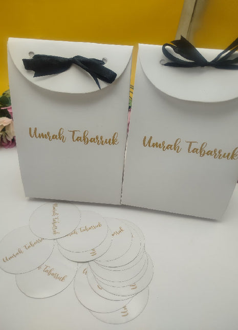 Hajj & Umrah Tabarruk Gift Set – Customized Bag, Tin Box & Zamzam Bottle (Complete Package)