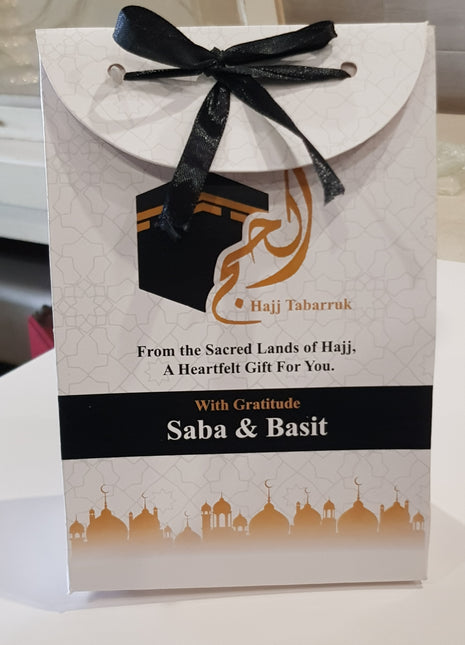 Hajj & Umrah Tabarruk Gift Set – Customized Bag, Tin Box & Zamzam Bottle (Complete Package)