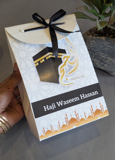 Hajj & Umrah Tabarruk Gift Set – Customized Bag, Tin Box & Zamzam Bottle (Complete Package)