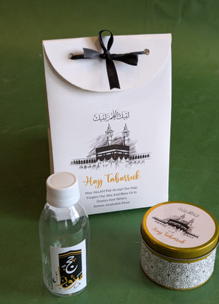 Hajj & Umrah Tabarruk Gift Set – Customized Bag, Tin Box & Zamzam Bottle (Complete Package)