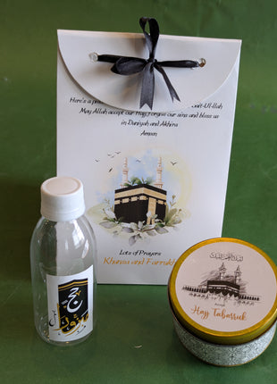 Hajj & Umrah Tabarruk Gift Set – Customized Bag, Tin Box & Zamzam Bottle (Complete Package)