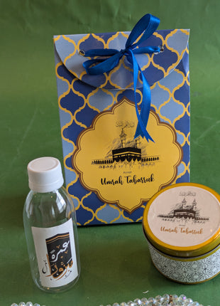 Hajj & Umrah Tabarruk Gift Set – Customized Bag, Tin Box & Zamzam Bottle (Complete Package)