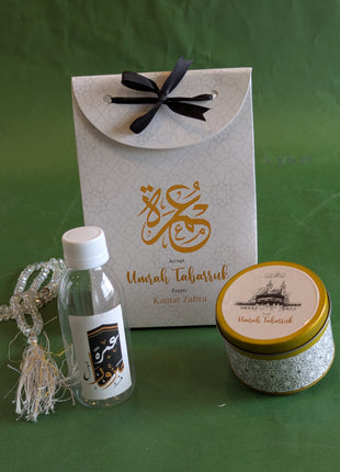 Hajj & Umrah Tabarruk Gift Set – Customized Bag, Tin Box & Zamzam Bottle (Complete Package)