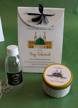 Hajj & Umrah Tabarruk Gift Set – Customized Bag, Tin Box & Zamzam Bottle (Complete Package)