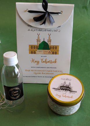Hajj & Umrah Tabarruk Gift Set – Customized Bag, Tin Box & Zamzam Bottle (Complete Package)