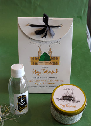 Hajj & Umrah Tabarruk Gift Set – Customized Bag, Tin Box & Zamzam Bottle (Complete Package)