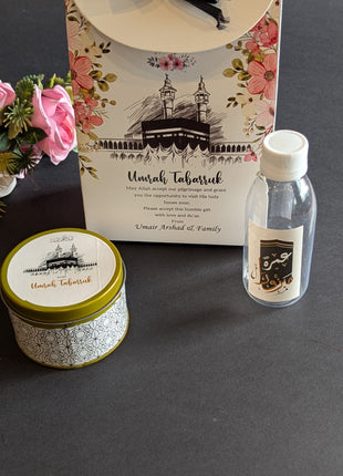 Hajj & Umrah Tabarruk Gift Set – Customized Bag, Tin Box & Zamzam Bottle (Complete Package)