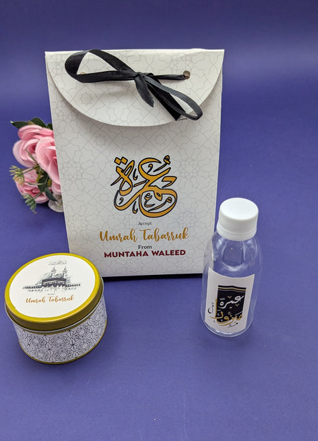 Hajj & Umrah Tabarruk Gift Set – Customized Bag, Tin Box & Zamzam Bottle (Complete Package)
