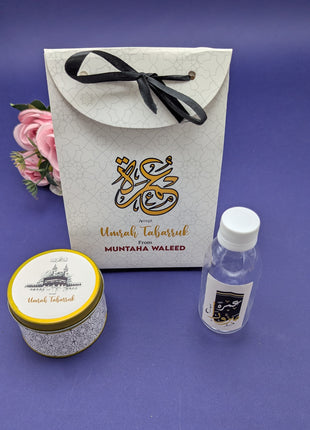 Hajj & Umrah Tabarruk Gift Set – Customized Bag, Tin Box & Zamzam Bottle (Complete Package)