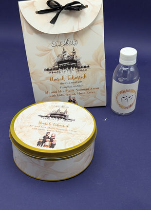 Hajj & Umrah Tabarruk Gift Set – Customized Bag, Tin Box & Zamzam Bottle (Complete Package)