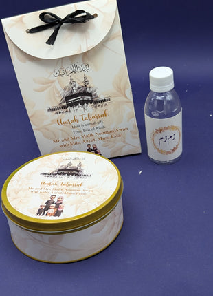 Hajj & Umrah Tabarruk Gift Set – Customized Bag, Tin Box & Zamzam Bottle (Complete Package)
