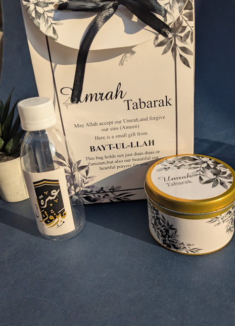 Hajj & Umrah Tabarruk Gift Set – Customized Bag, Tin Box & Zamzam Bottle (Complete Package)