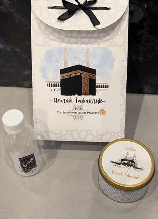 Hajj & Umrah Tabarruk Gift Set – Customized Bag, Tin Box & Zamzam Bottle (Complete Package)
