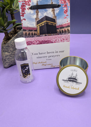 Hajj & Umrah Tabarruk Gift Set – Customized Bag, Tin Box & Zamzam Bottle (Complete Package)