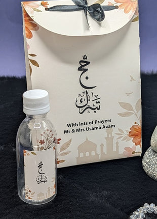 Hajj & Umrah Tabarruk Gift Set – Customized Bag, Tin Box & Zamzam Bottle (Complete Package)