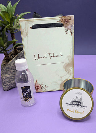 Hajj & Umrah Tabarruk Gift Set – Customized Bag, Tin Box & Zamzam Bottle (Complete Package)