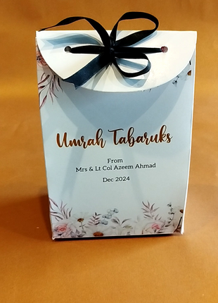 Hajj & Umrah Tabarruk Gift Set – Customized Bag, Tin Box & Zamzam Bottle (Complete Package)