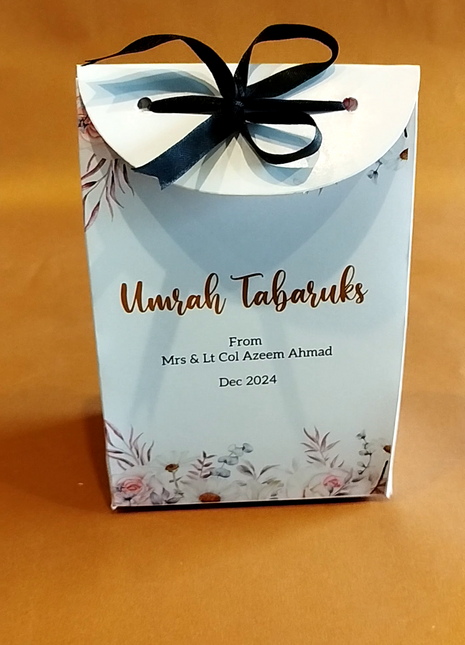 Hajj & Umrah Tabarruk Gift Set – Customized Bag, Tin Box & Zamzam Bottle (Complete Package)
