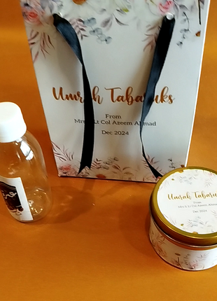 Hajj & Umrah Tabarruk Gift Set – Customized Bag, Tin Box & Zamzam Bottle (Complete Package)