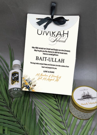 Hajj & Umrah Tabarruk Gift Set – Customized Bag, Tin Box & Zamzam Bottle (Complete Package)