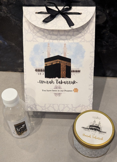 Hajj & Umrah Tabarruk Gift Set – Customized Bag, Tin Box & Zamzam Bottle (Complete Package)