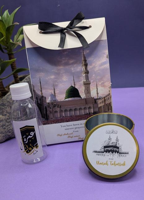 Hajj & Umrah Tabarruk Gift Set – Customized Bag, Tin Box & Zamzam Bottle (Complete Package)