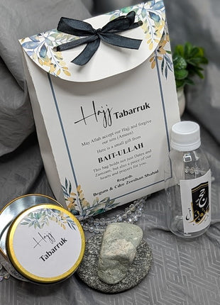 Hajj & Umrah Tabarruk Gift Set – Customized Bag, Tin Box & Zamzam Bottle (Complete Package)
