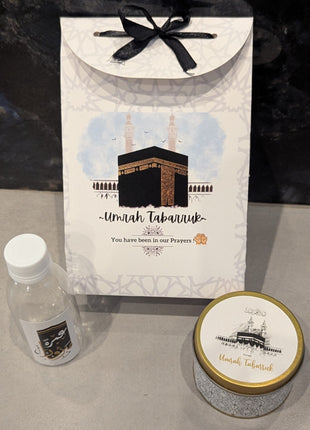Hajj & Umrah Tabarruk Gift Set – Customized Bag, Tin Box & Zamzam Bottle (Complete Package)