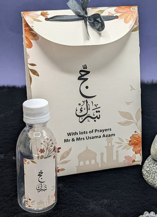 Hajj & Umrah Tabarruk Gift Set – Customized Bag, Tin Box & Zamzam Bottle (Complete Package)