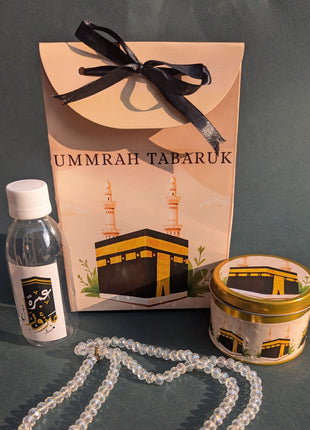 Hajj & Umrah Tabarruk Gift Set – Customized Bag, Tin Box & Zamzam Bottle (Complete Package)