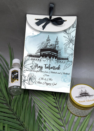Hajj & Umrah Tabarruk Gift Set – Customized Bag, Tin Box & Zamzam Bottle (Complete Package)