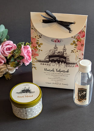 Hajj & Umrah Tabarruk Gift Set – Customized Bag, Tin Box & Zamzam Bottle (Complete Package)